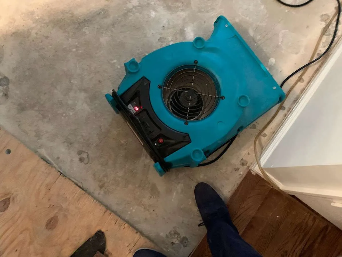 Air mover drying subfloor during Leak Detection & Repair in South Jordan